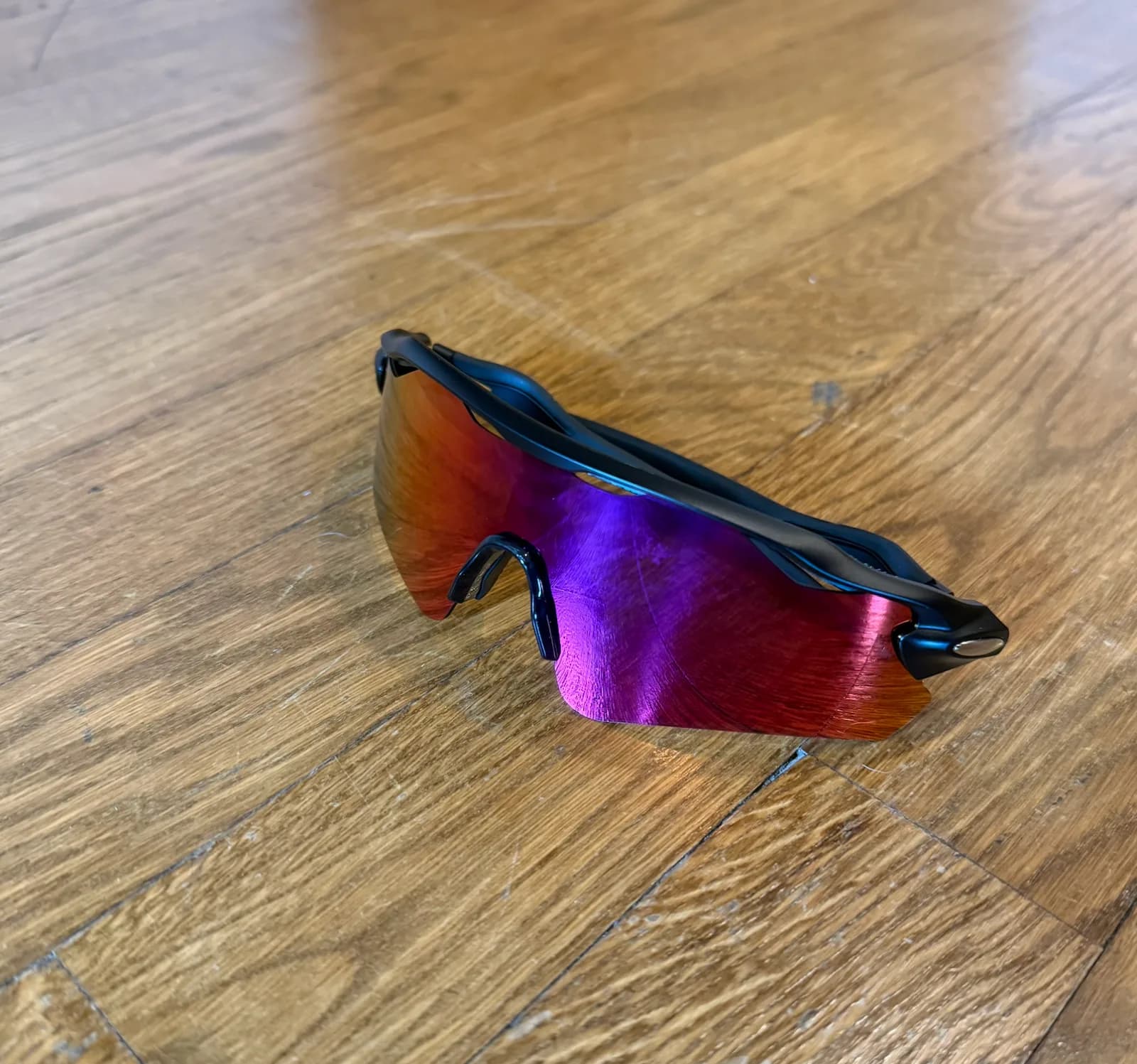 Purple lens sports glasses